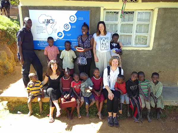 The Checheza team with partners and children